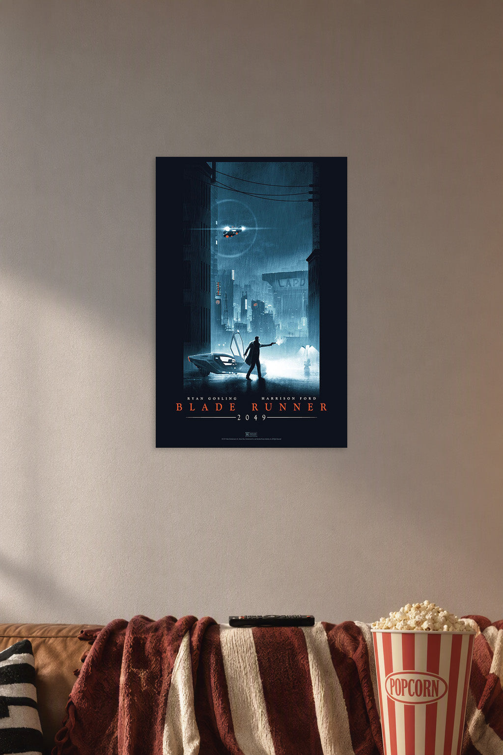 Blade Runner 2049 Movie in a cozy movie room above a brown sofa with popcorn.