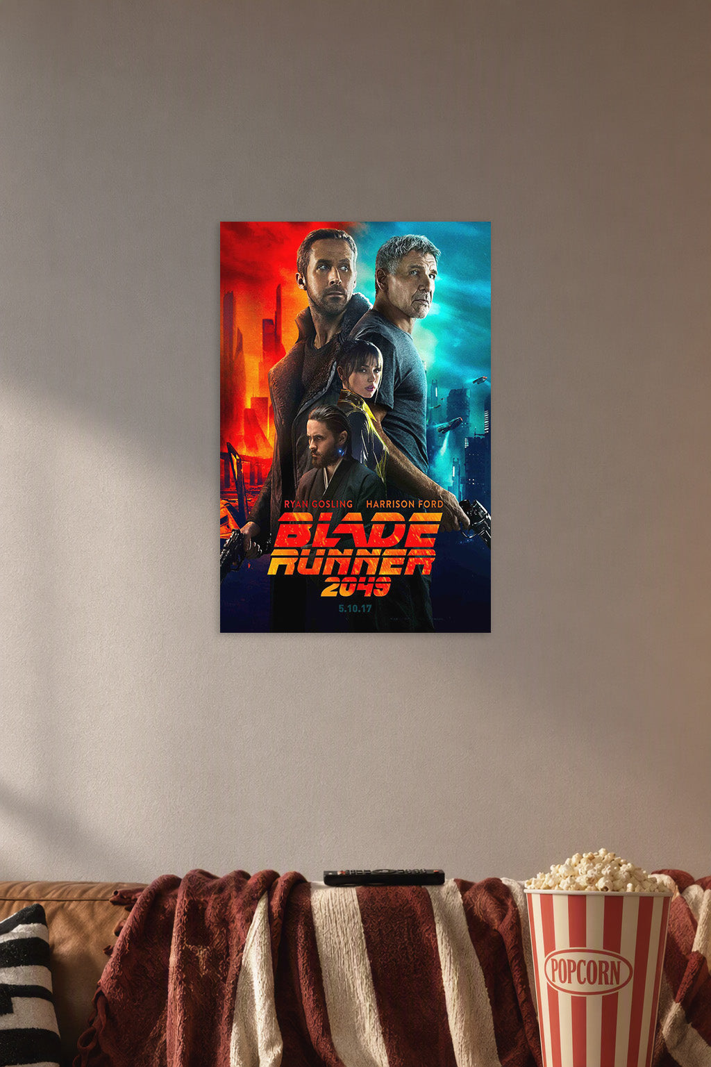 Blade Runner 2049 Movie Poster with Ryan Gosling and Harrison Ford in a cozy movie room above a brown sofa with popcorn.