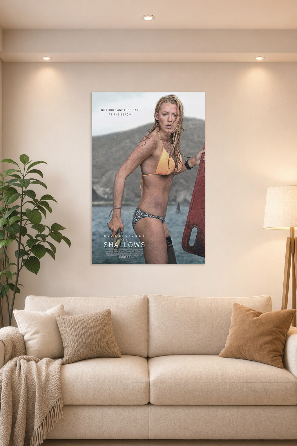 Blake Lively The Shallows Movie Poster in a bright living room above a beige sofa.