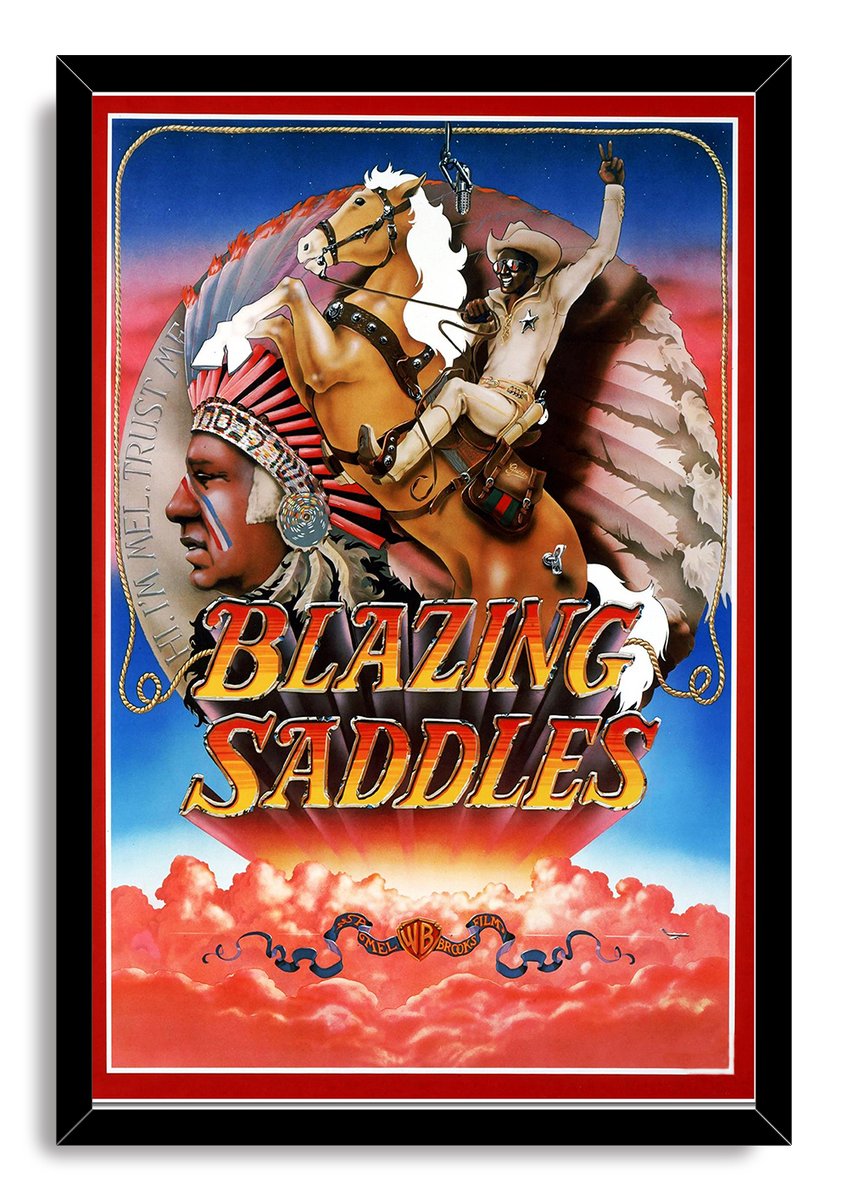 Blazing Saddles framed wall art print with a black border, cowboy on horseback, Native American profile, and Western-style title.