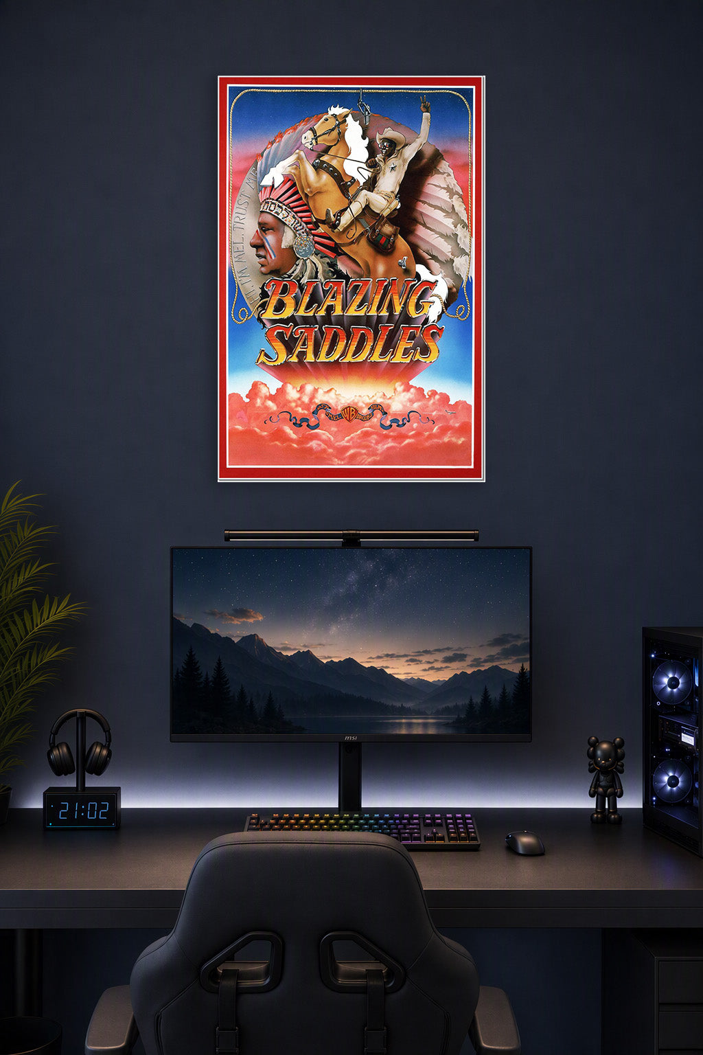 Blazing Saddles Movie Poster in a gaming desk setup above a monitor.