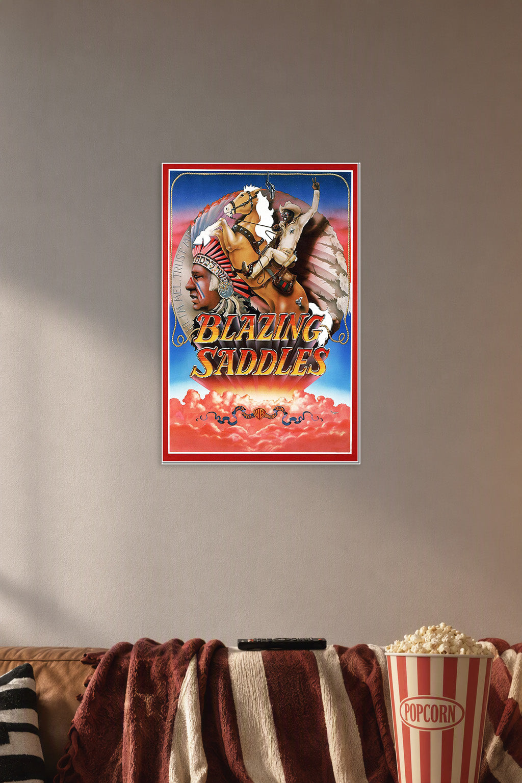 Blazing Saddles Movie Poster in a cozy movie room above a brown sofa with popcorn.