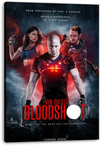 Bloodshot canvas wall art print displays Vin Diesel with red glowing chest lights, a woman holding a vial, and an armored man against a smoky sci-fi backdrop.