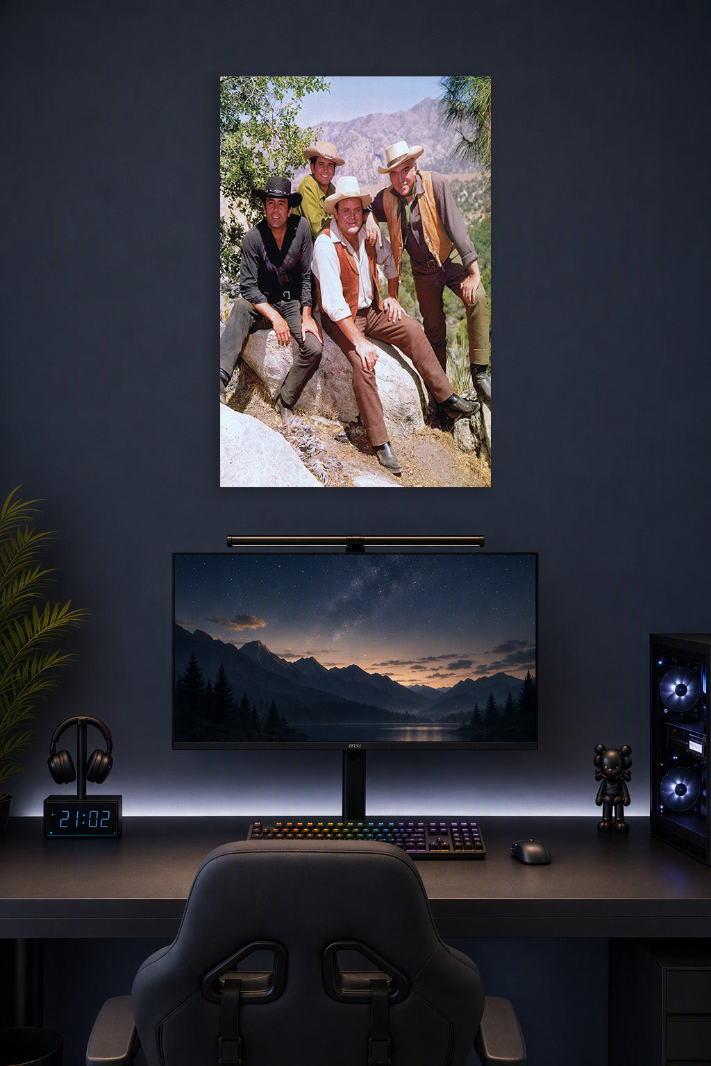 Bonanza TV Show Cast in a gaming desk setup above a monitor.