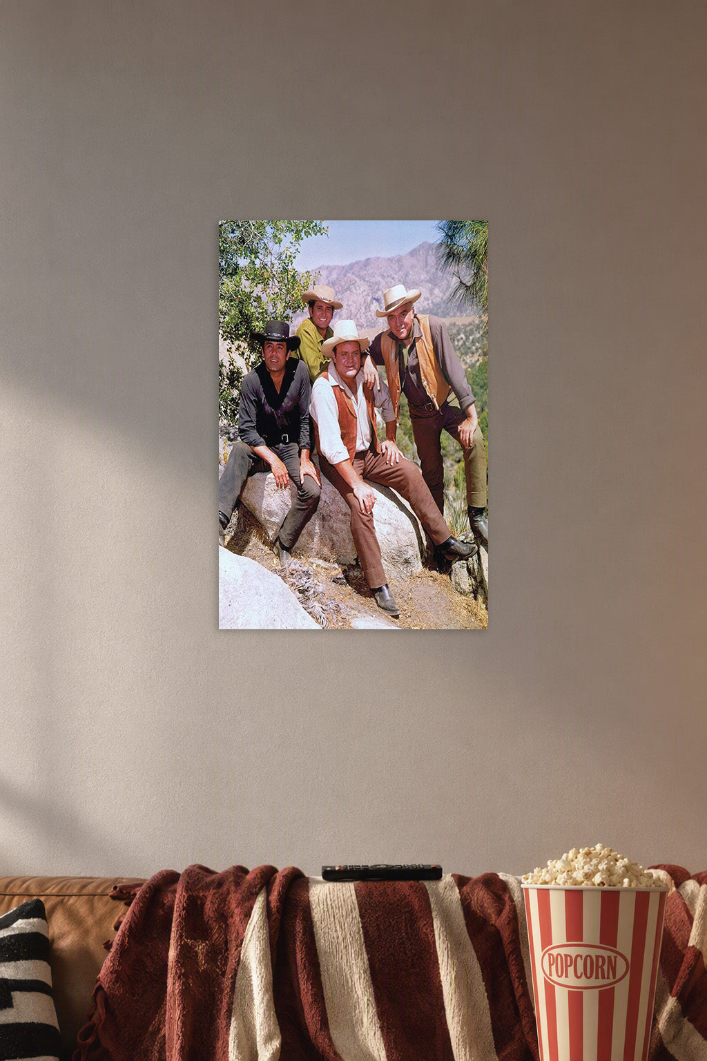 Bonanza TV Show Cast in a cozy movie room above a brown sofa with popcorn.