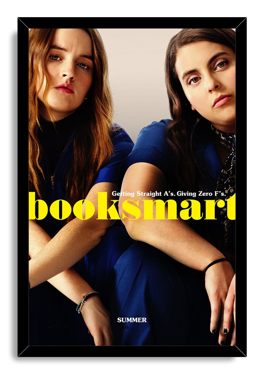 Booksmart framed wall art print featuring two women in blue, yellow title lettering, and a black frame.