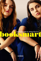 Booksmart poster featuring two young women in blue outfits seated close together, with bold yellow title text.