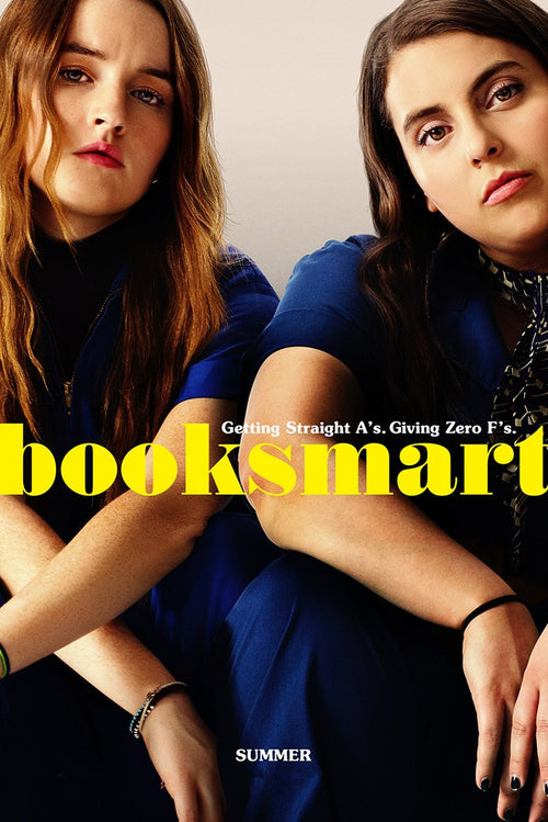 Booksmart poster featuring two young women in blue outfits seated close together, with bold yellow title text.