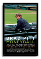 Moneyball framed wall art print with Brad Pitt at a baseball stadium, green field backdrop, black frame, and movie credits.
