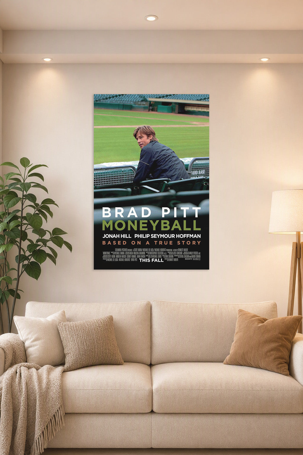 Brad Pitt Moneyball in a bright living room above a beige sofa.