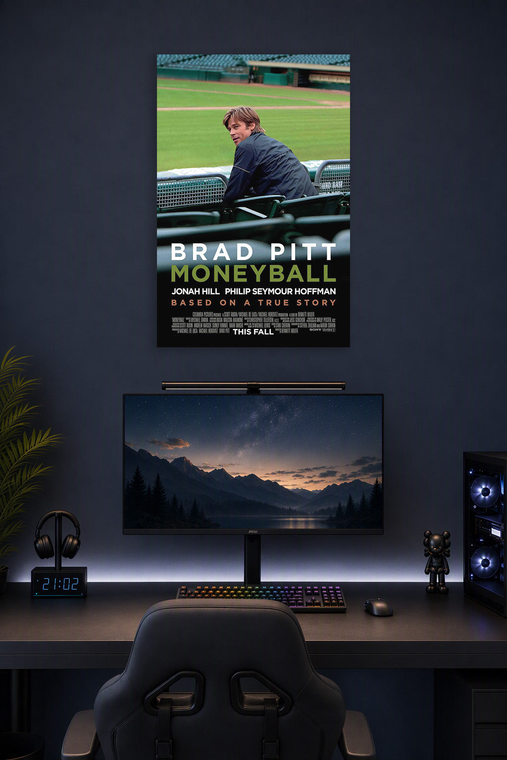 Brad Pitt Moneyball in a gaming desk setup above a monitor.