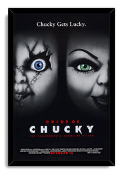 Bride of Chucky framed wall art print presents Chucky and Tiffany's shadowed faces, contrasting blue and green eyes, and red and white film typography.