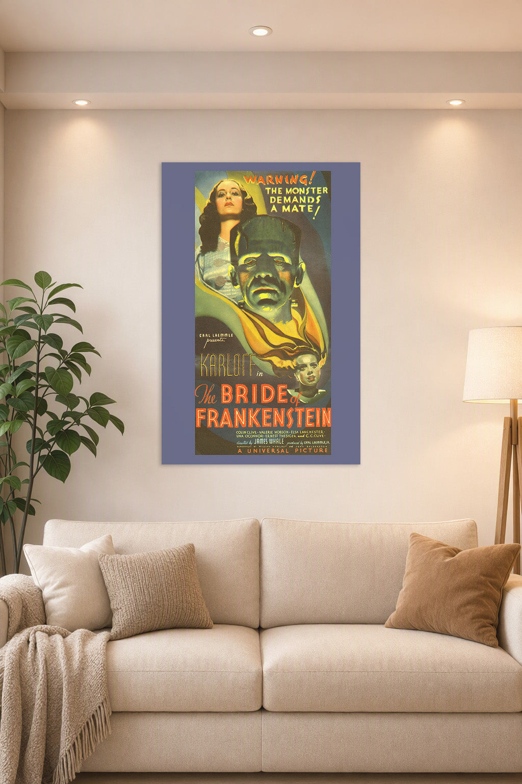 Bride of Frankenstein Movie Poster in a bright living room above a beige sofa.