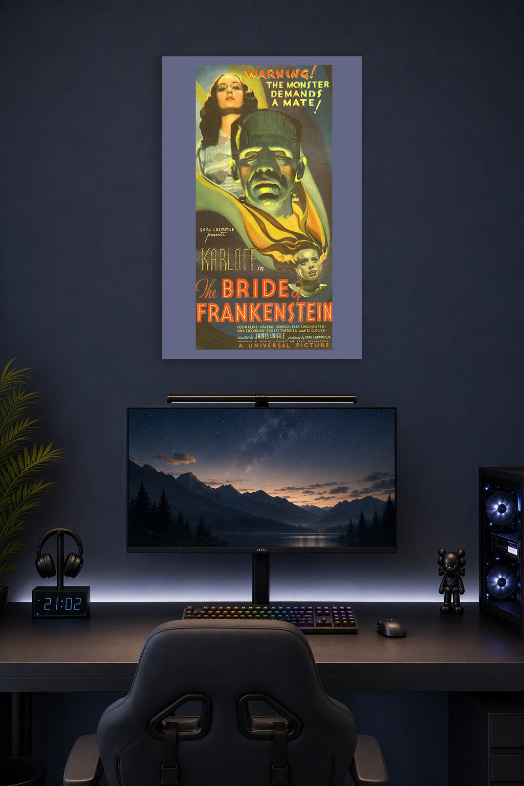 Bride of Frankenstein Movie Poster in a gaming desk setup above a monitor.