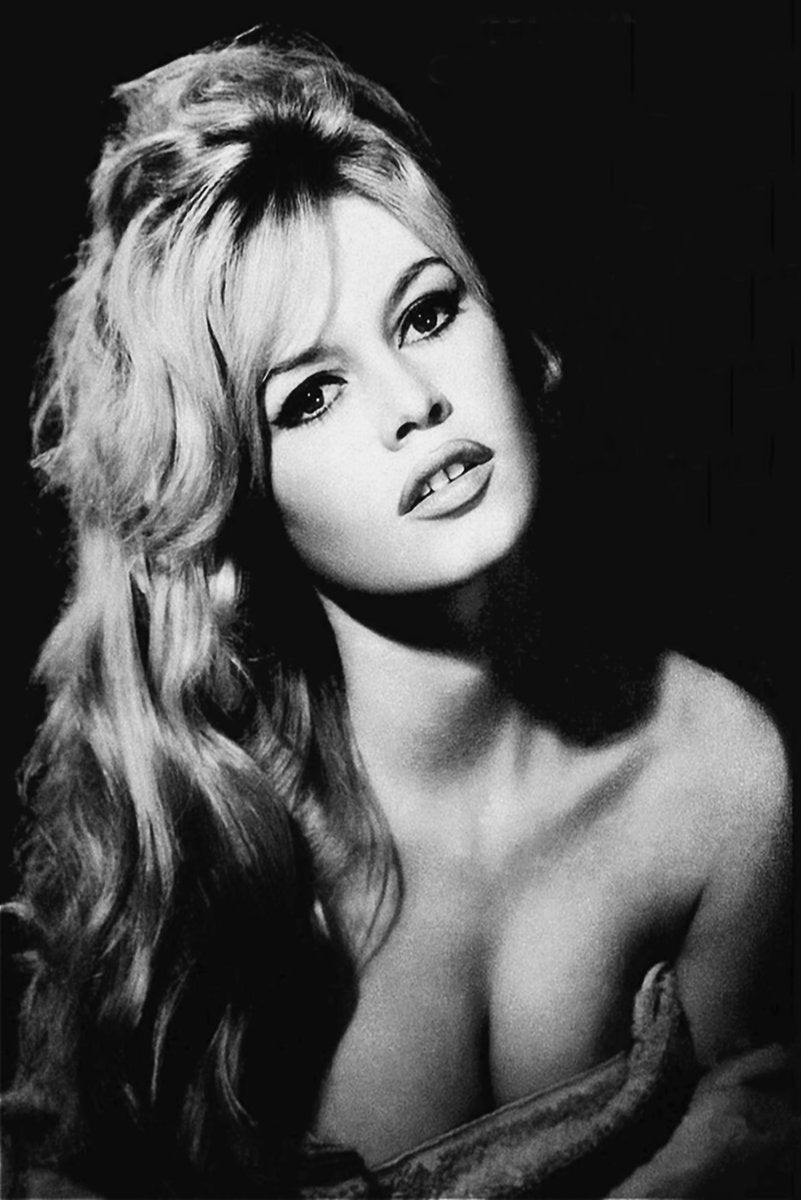 Brigitte Bardot wall art print featuring a black-and-white close-up portrait with long wavy hair, dark eyeliner, and an off-shoulder top.