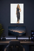 Bristol Palin in a gaming desk setup above a monitor.