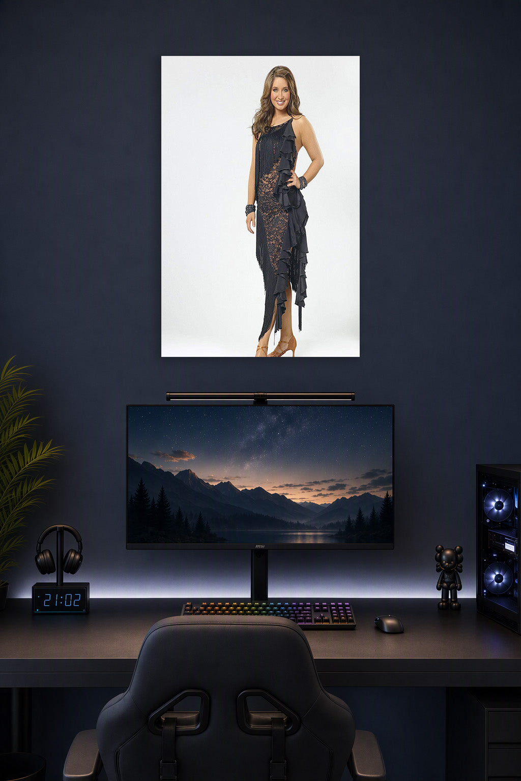 Bristol Palin in a gaming desk setup above a monitor.