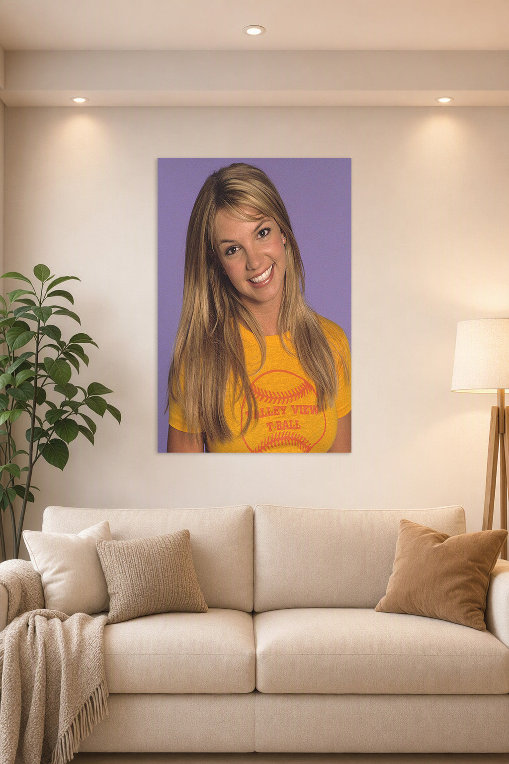 Britney Spears in a bright living room above a beige sofa.