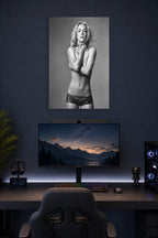 Britney Spears in a gaming desk setup above a monitor.