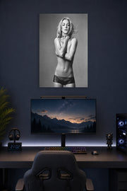 Britney Spears in a gaming desk setup above a monitor.