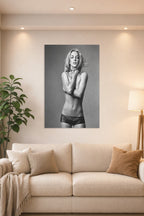 Britney Spears in a bright living room above a beige sofa.