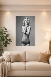 Britney Spears in a bright living room above a beige sofa.