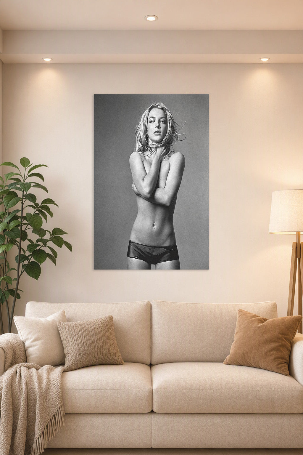Britney Spears in a bright living room above a beige sofa.