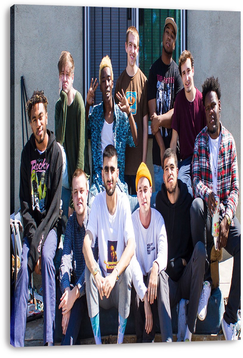 Brockhampton canvas wall art print displaying the group seated and standing together outdoors, wrapped around deep canvas edges.
