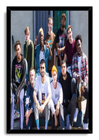 Brockhampton framed wall art print featuring eleven casually dressed members posed outdoors in a sleek black frame.