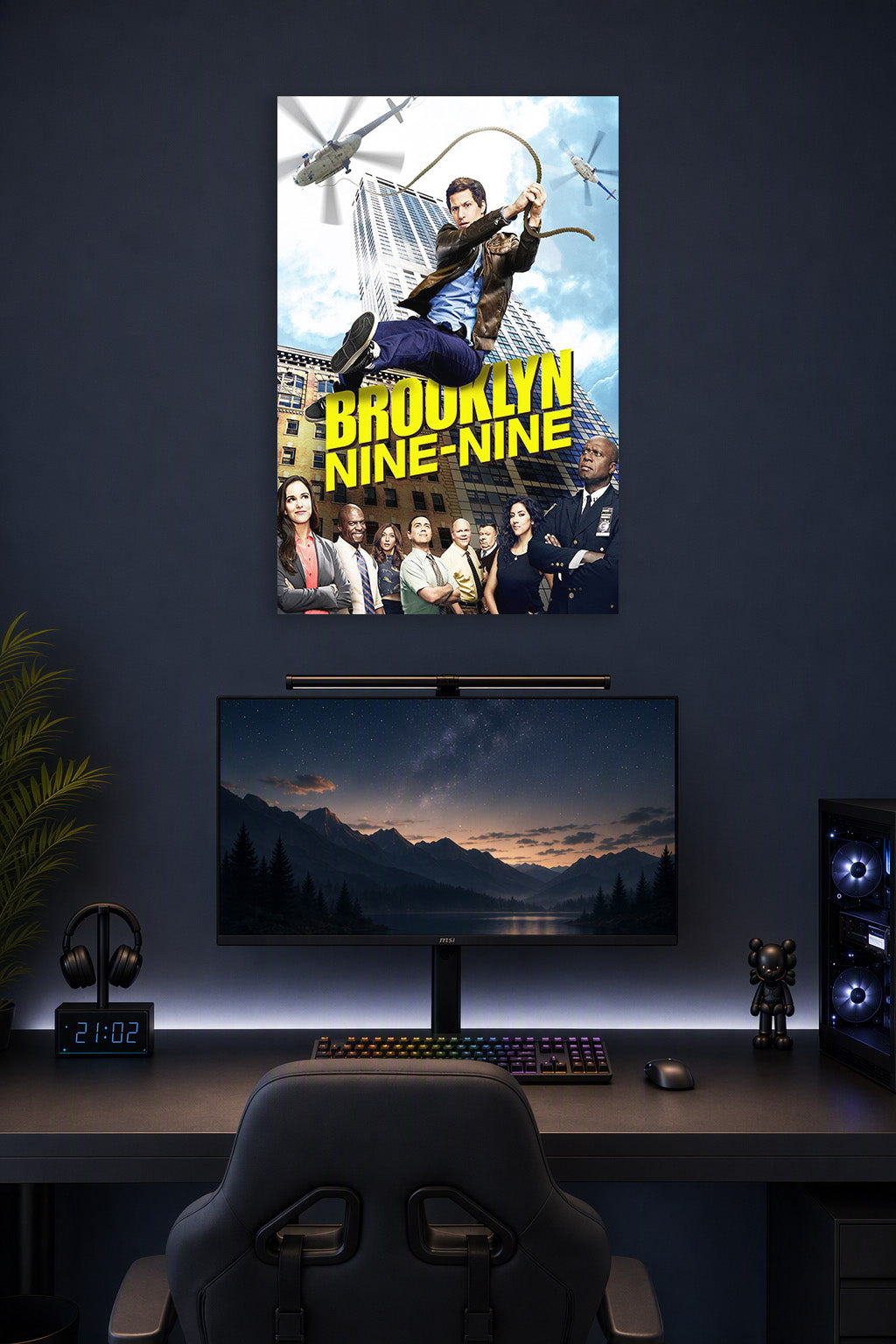 Brooklyn Nine-Nine TV Show in a gaming desk setup above a monitor.