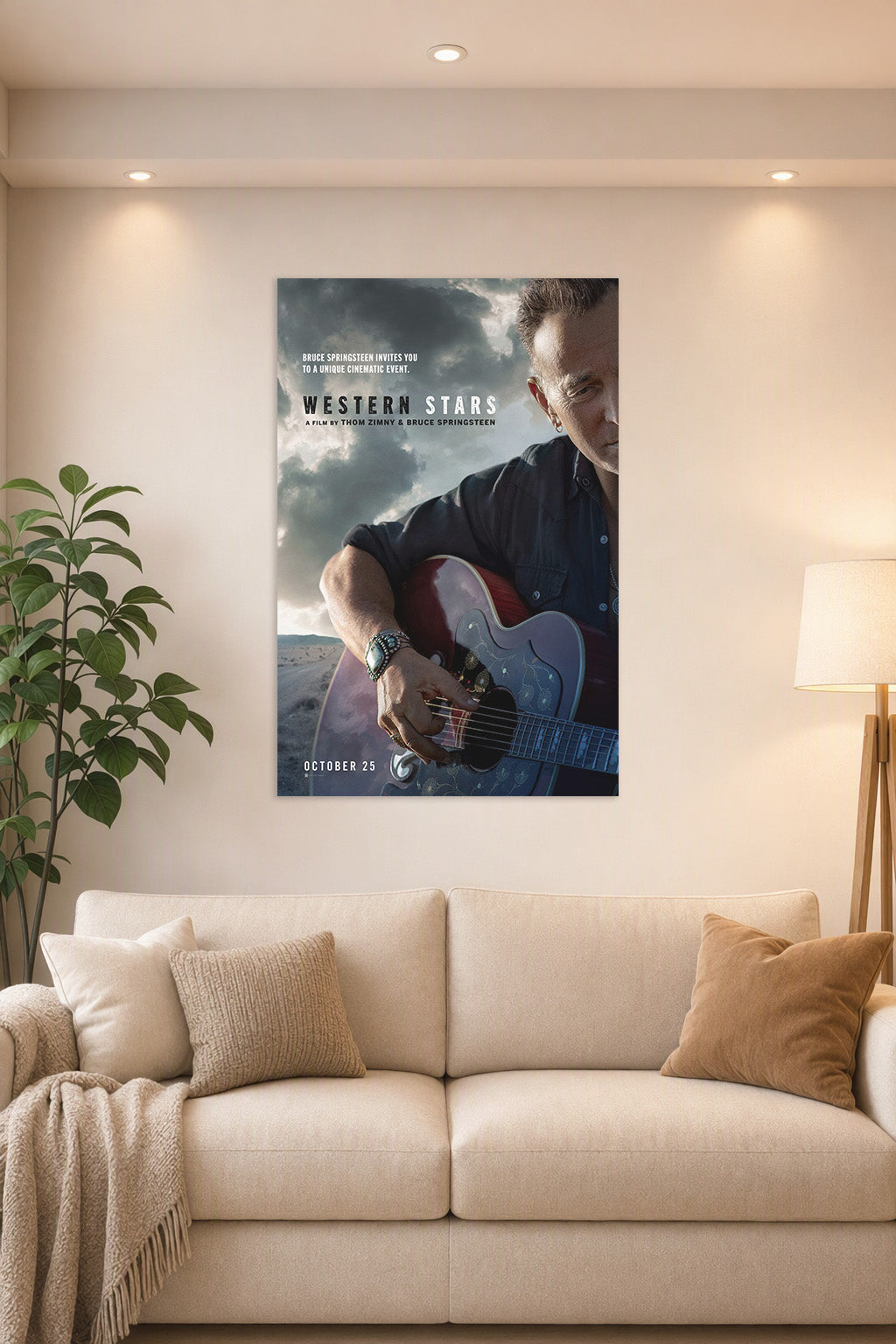 Bruce Springsteen in a bright living room above a beige sofa.