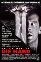 Die Hard movie poster wall art with Bruce Willis beside an exploding skyscraper, helicopter, city lights, and red title text.