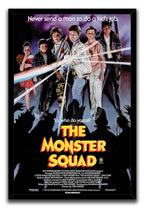 The Monster Squad framed wall art print presents six young heroes, bright light rays, purple clouds, and dark creature silhouettes.