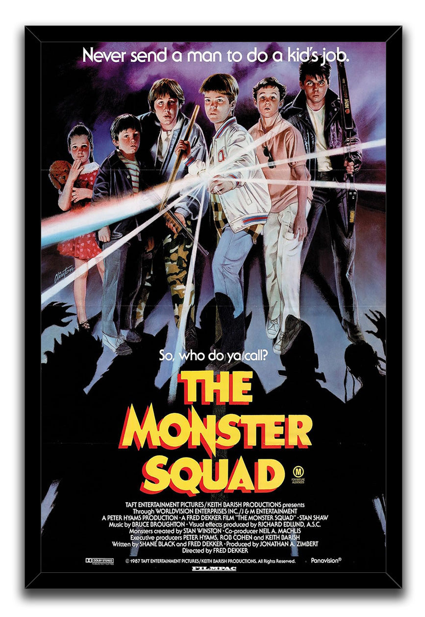 The Monster Squad framed wall art print presents six young heroes, bright light rays, purple clouds, and dark creature silhouettes.