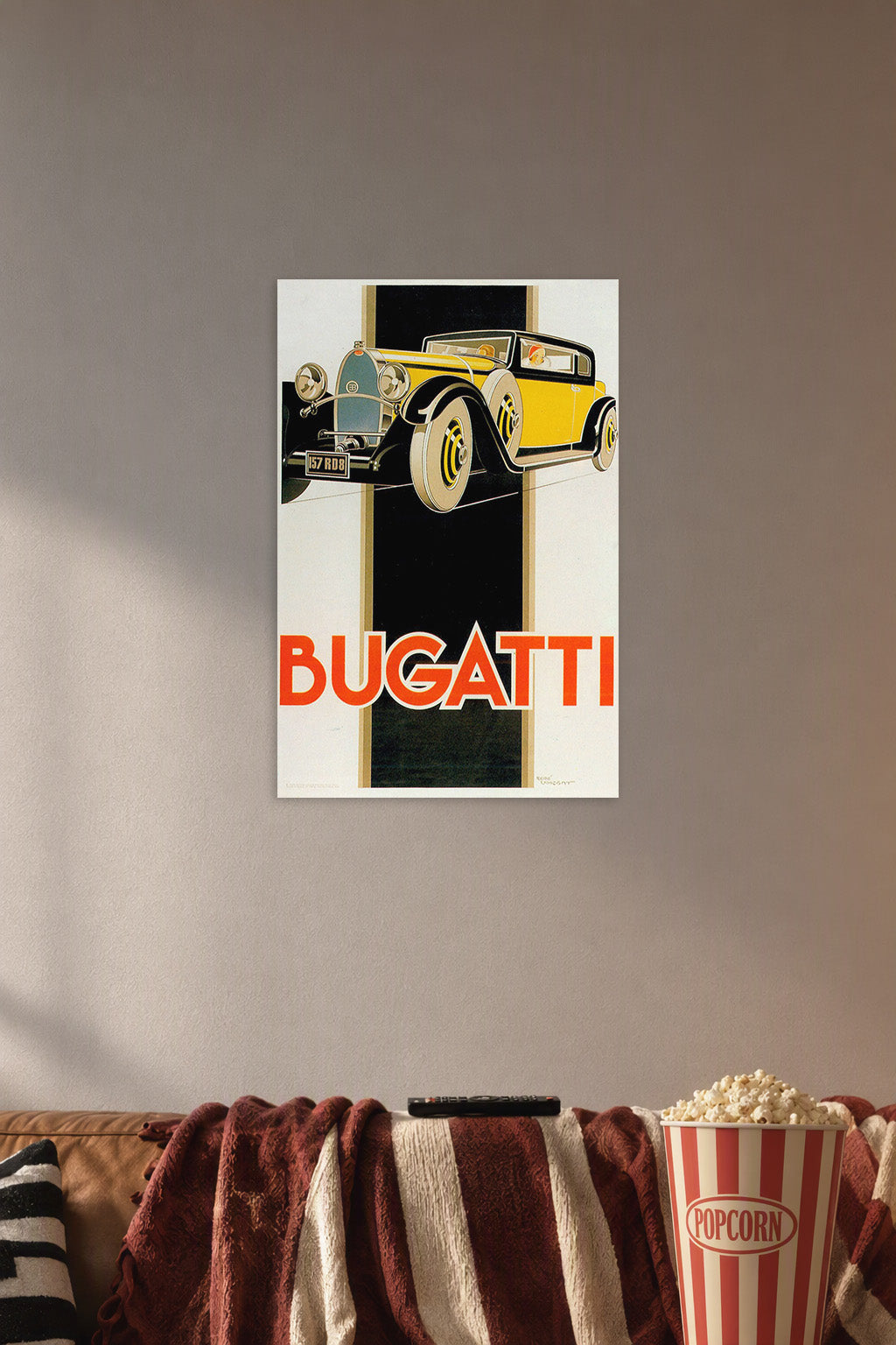 Bugatti Car Art Deco in a cozy movie room above a brown sofa with popcorn.