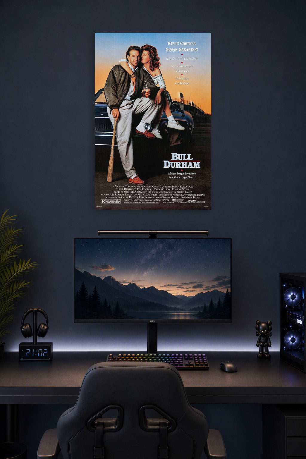 Bull Durham Movie Poster in a gaming desk setup above a monitor.
