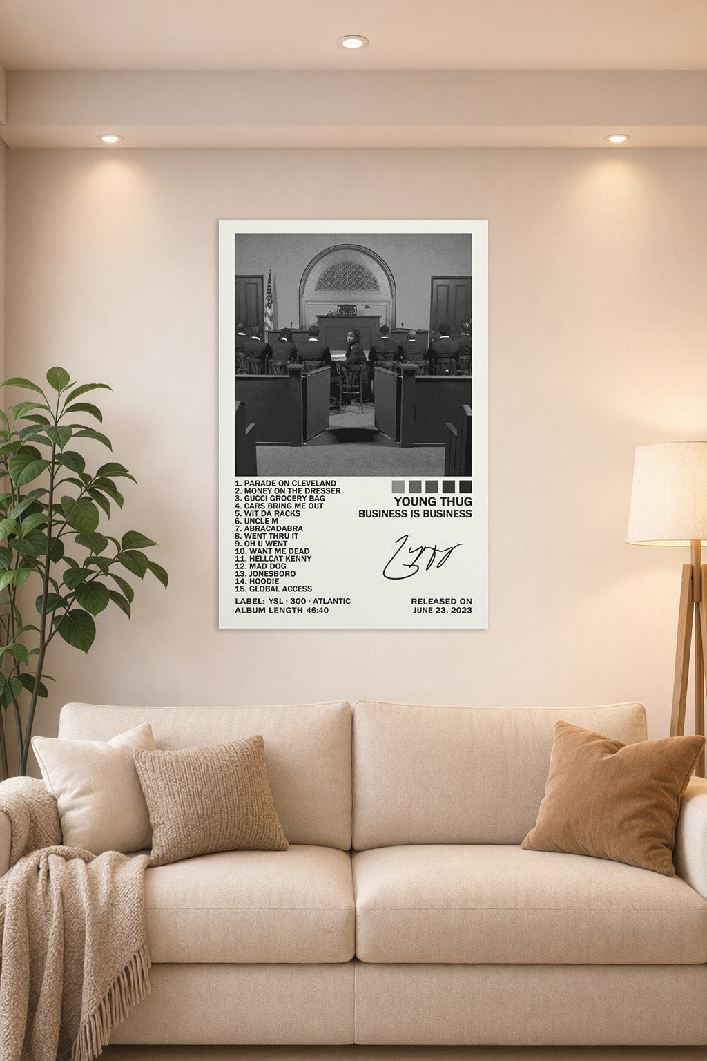 Business Is Business Poster in a bright living room above a beige sofa.