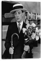 Buster Keaton canvas wall art print presents a black-and-white portrait of the actor with a curved cane and large rose bouquet.