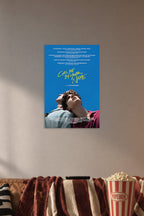 Call Me By Your Name Movie Poster in a cozy movie room above a brown sofa with popcorn.