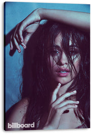Camila Cabello canvas wall art print displays her wet-haired portrait with hands posed around her face against blue.