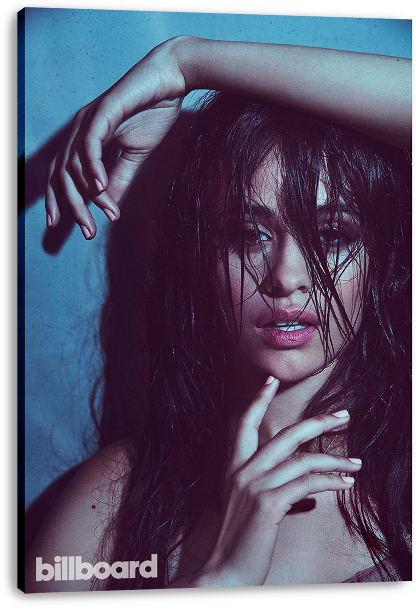 Camila Cabello canvas wall art print displays her wet-haired portrait with hands posed around her face against blue.