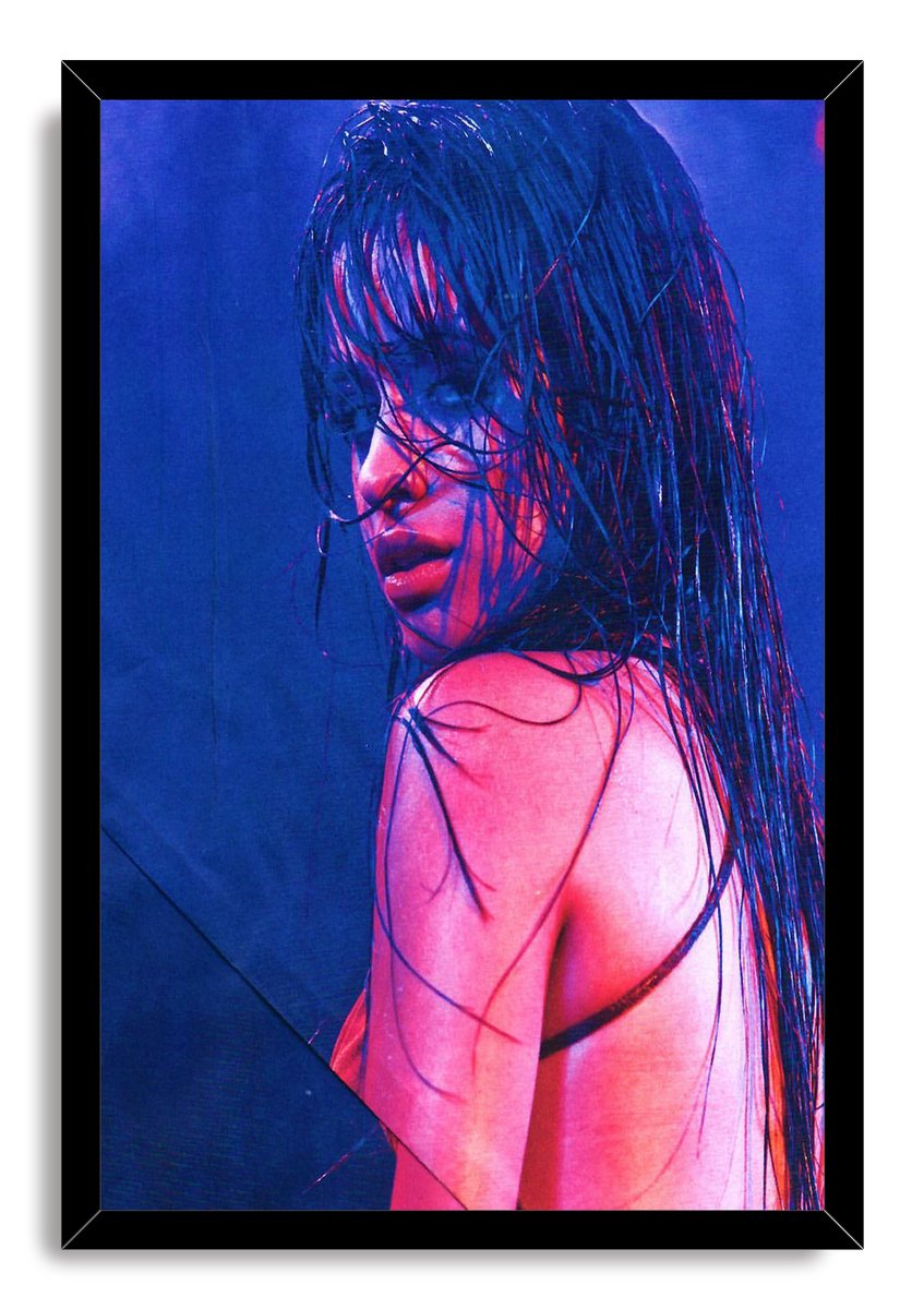 Camila Cabello framed wall art print presents a moody close-up portrait with wet dark hair against a deep blue background.