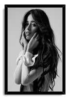 Camila Cabello framed wall art print displays a black-and-white portrait of the singer with flowing hair inside a black frame.