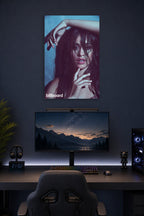 Camila Cabello in a gaming desk setup above a monitor.