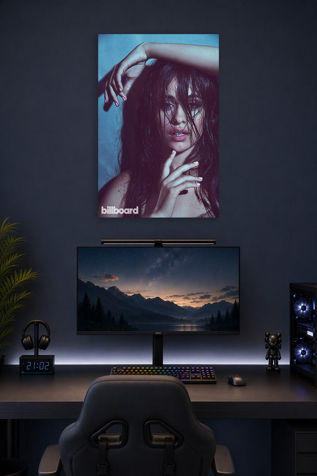 Camila Cabello in a gaming desk setup above a monitor.