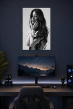 Camila Cabello in a gaming desk setup above a monitor.