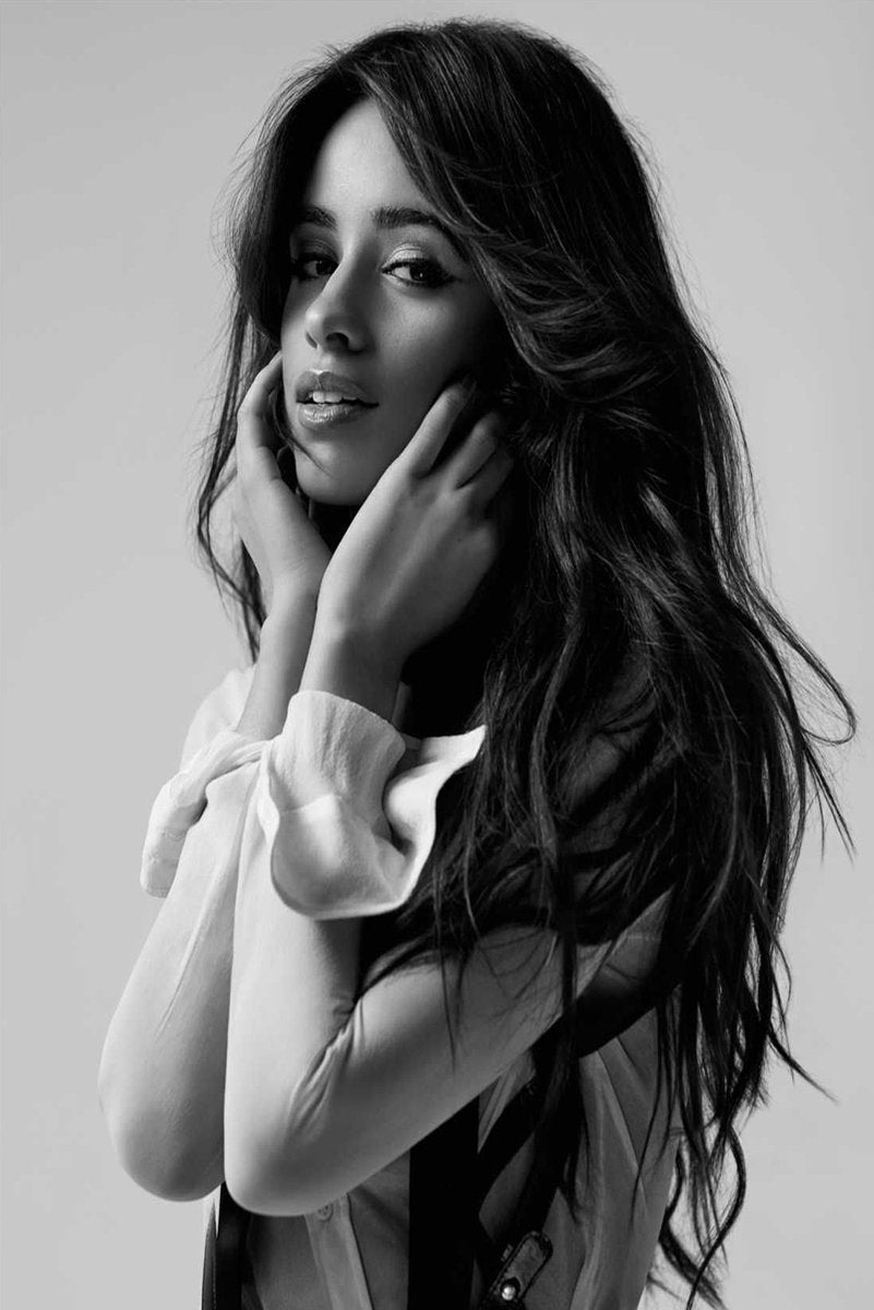 Camila Cabello wall art print features a black-and-white portrait of the singer with long hair and hands at her face.