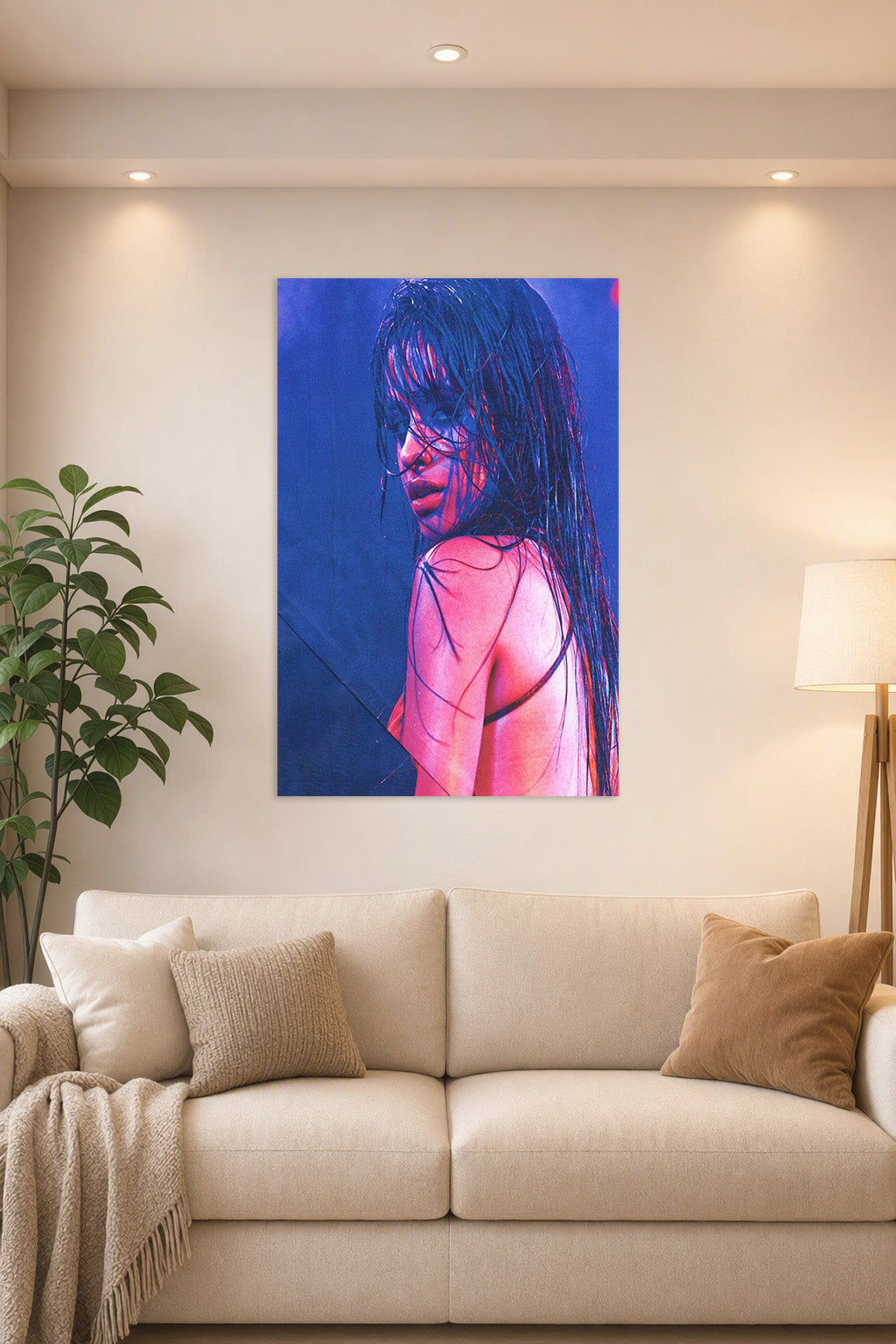 Camila Cabello in a bright living room above a beige sofa.