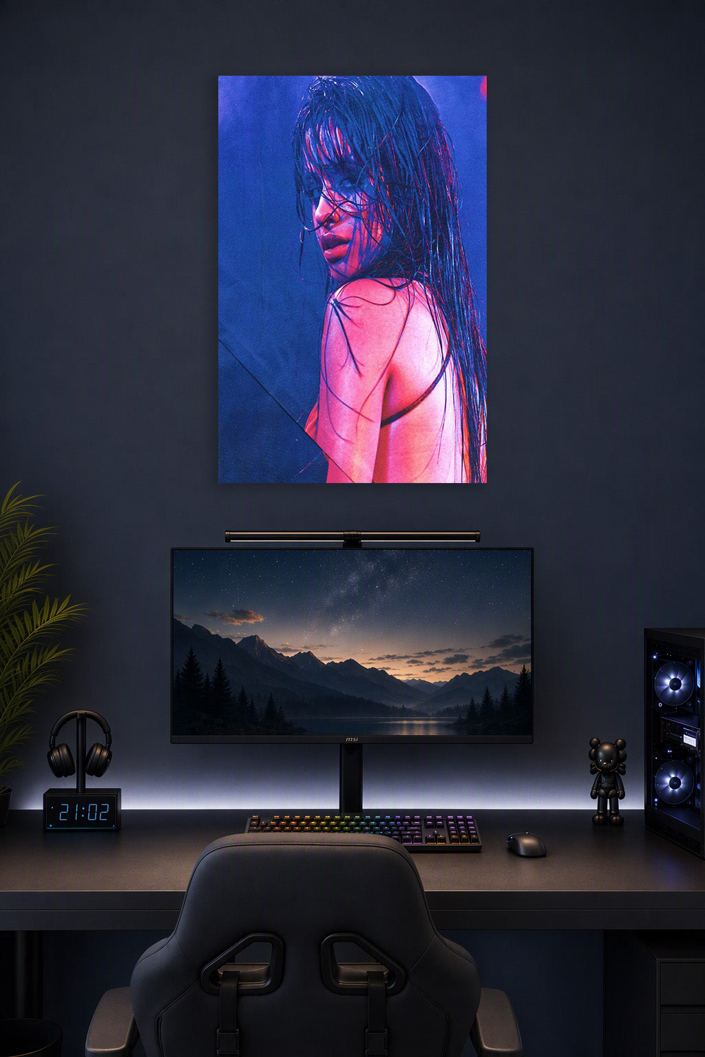 Camila Cabello in a gaming desk setup above a monitor.
