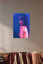 Camila Cabello in a cozy movie room above a brown sofa with popcorn.